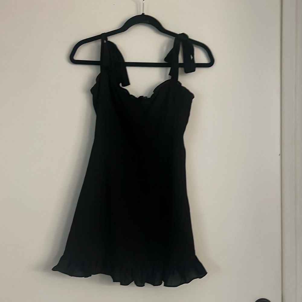 Black flirty dress with ruffles